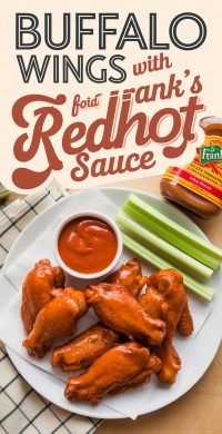 a plate of chicken wings and dip